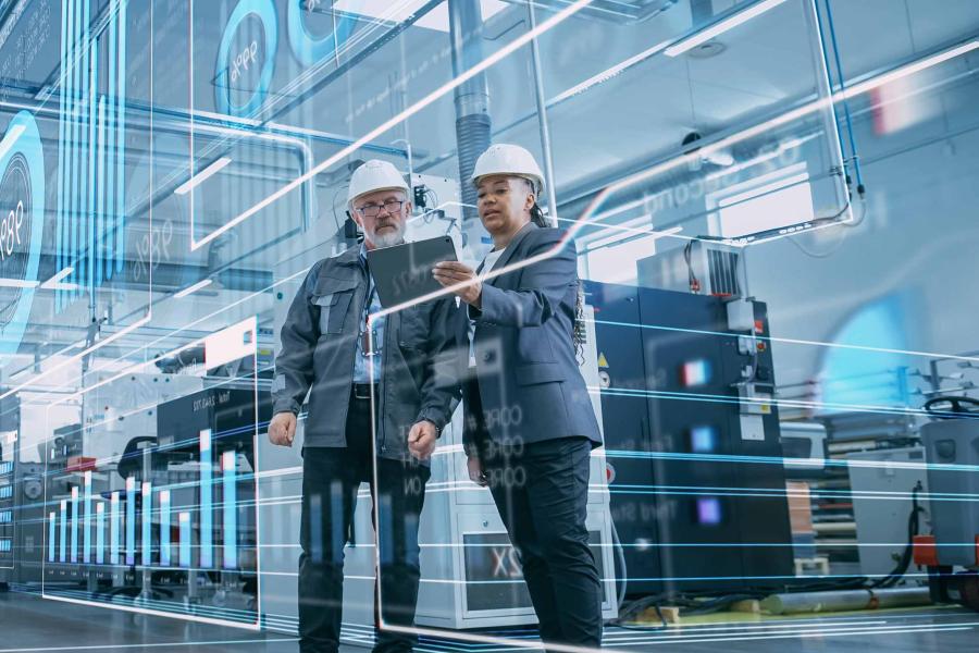 Two people working on AI project in workshop